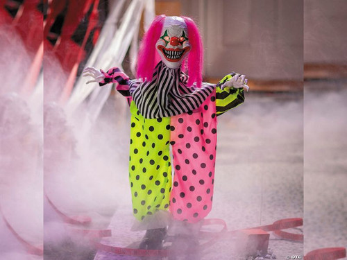 35 inch animated Halloween clown with pink hair and multicolor suit