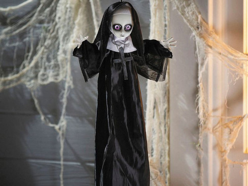 Hanging Halloween nun decoration with black and white habit and cross
