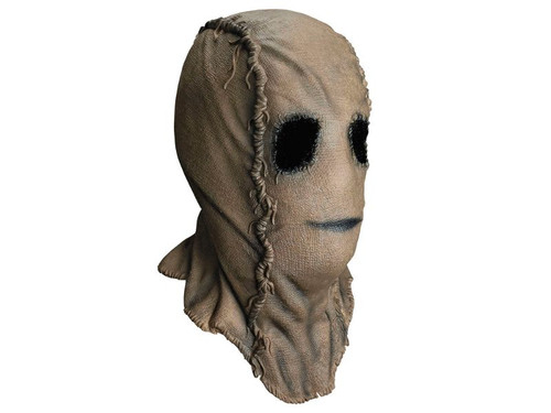 Adult wearing The Strangers Scarecrow mask from Trick or Treat Studios
