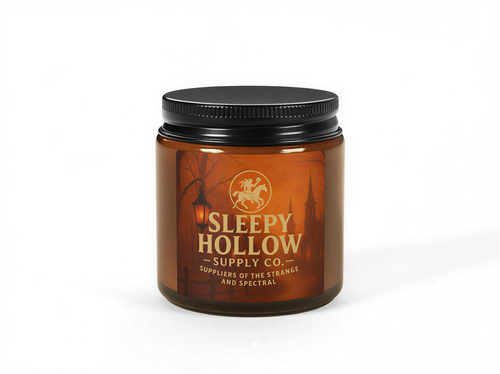 Halloween-themed soy candle in amber jar with Sleepy Hollow artwork