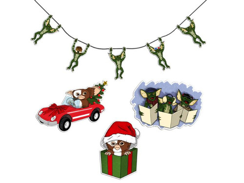 A collection of stickers shows characters from the movie Gremlins hanging from a string, singing Christmas carols, and riding in a red convertible with a Christmas tree in the back.