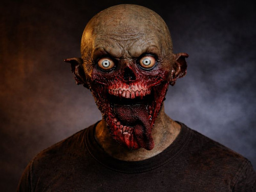 A close-up shot of a grotesque zombie mask with exposed teeth and bloody flesh, against a smoky, dark background.
