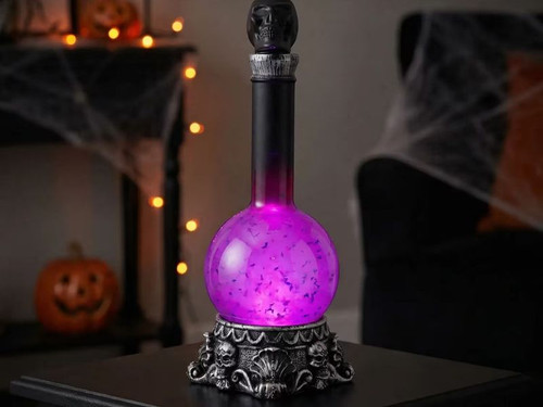 light up purple potion bottle with skull base halloween decoration