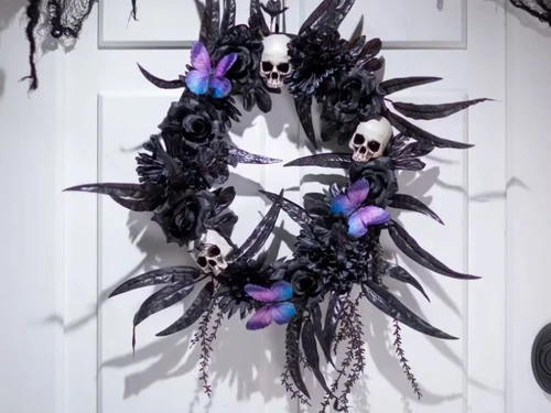 dark floral halloween wreath with skulls spiders butterflies