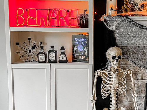 Beware Neon Halloween Sign Displayed on a shelf