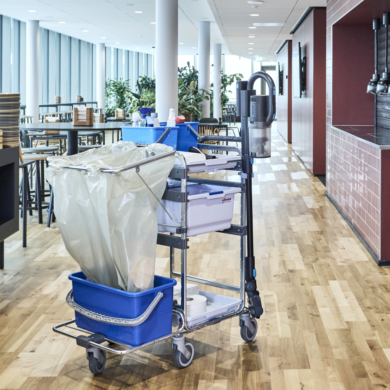 Nilfisk Advance VU200 mounted on janitorial cart for fast grab-and-go cleaning