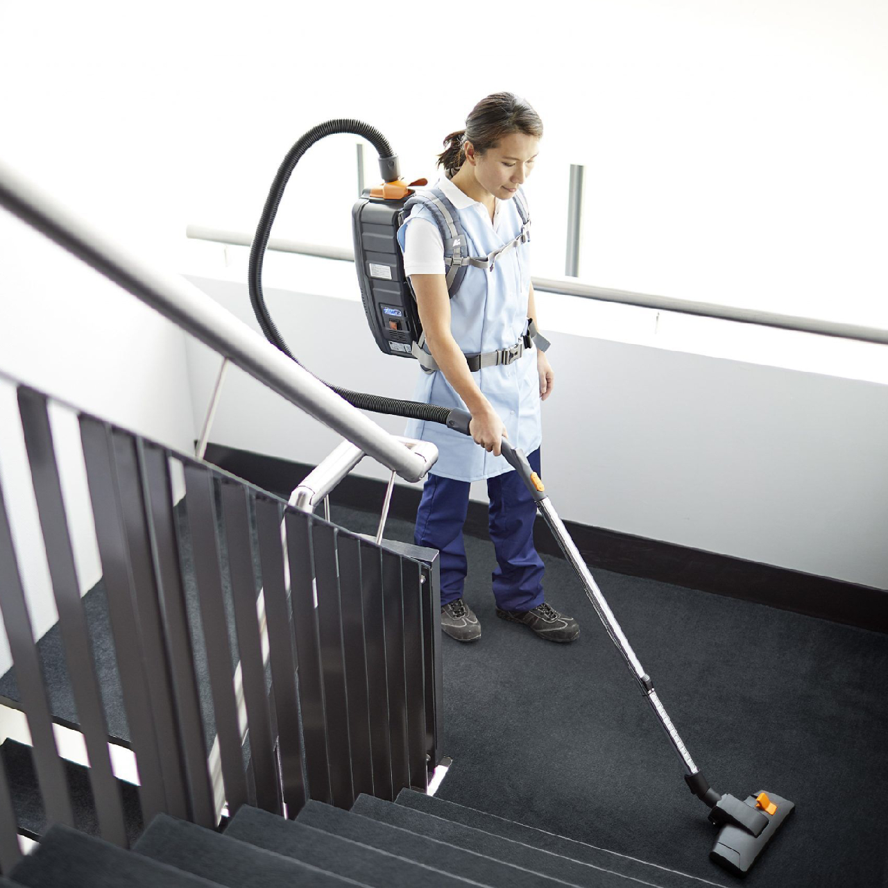 TASKI AERO BP E backpack vacuum cleaning stairs in commercial facility