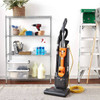 TASKI jet upright vacuum cleaning carpet in commercial storage room with tools and supplies
