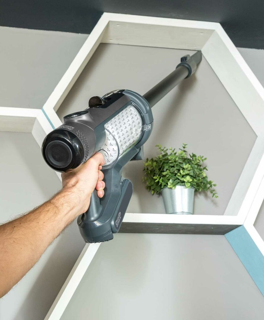 Numatic The Quick cordless vacuum extended reach cleaning under furniture and edges