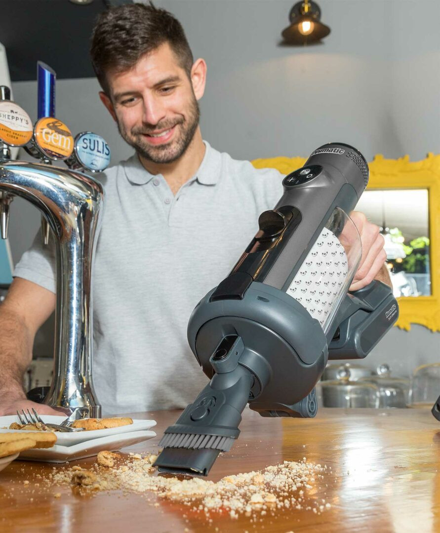 NaceCare The Quick cordless vacuum used for countertop and surface cleaning in commercial environments
