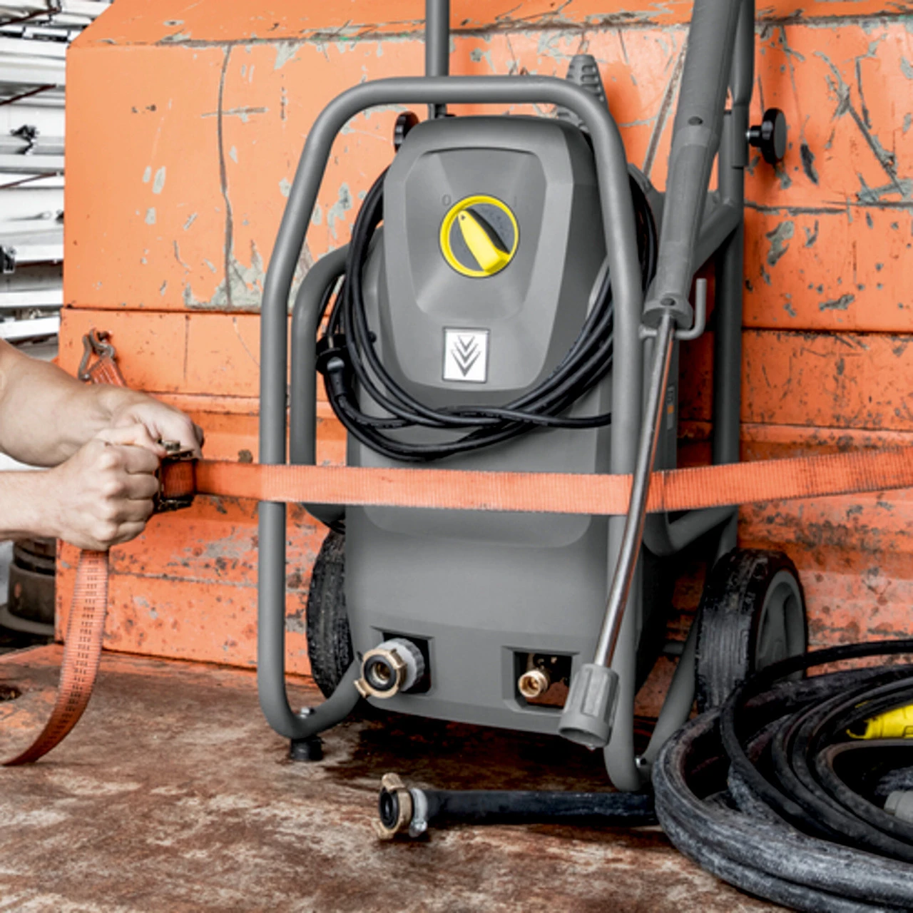 Karcher HD Mid Class Cage pressure washer secured for transport in a commercial work vehicle.