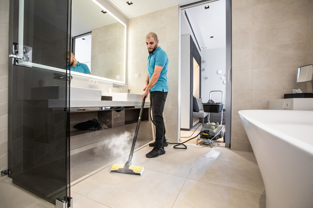 SG 4/4 Commercial Steam Cleaner with Transport Cart | Karcher 9.841-414.0 in use bathroom image