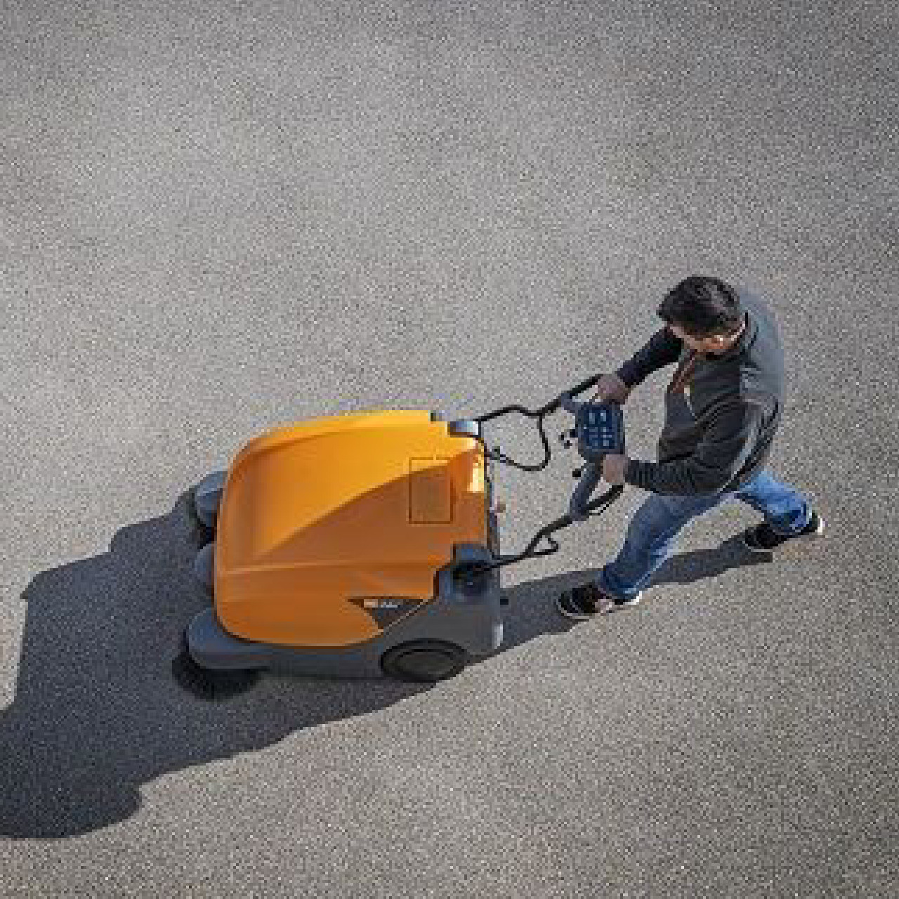 Front view of TASKI Balimat 3300 industrial sweeper in outdoor commercial environment