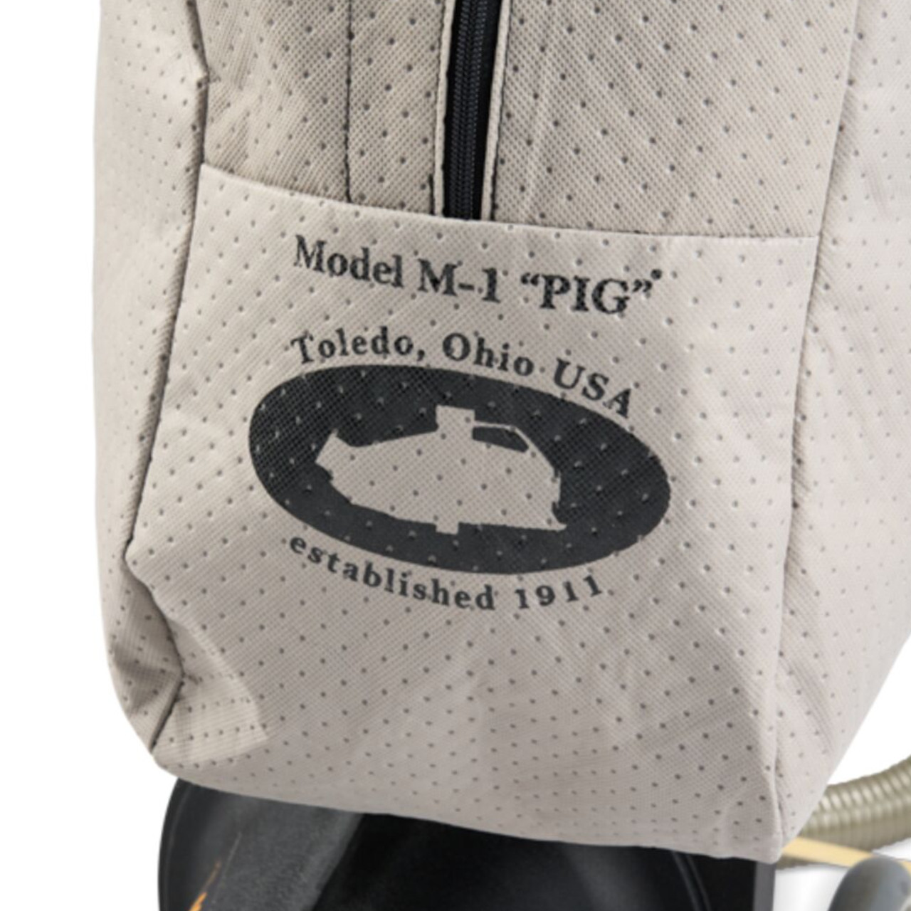 Close-up detail of the NSS Model M-1 “PIG” industrial vacuum bag showing Toledo, Ohio USA branding and durable cloth filter bag construction.