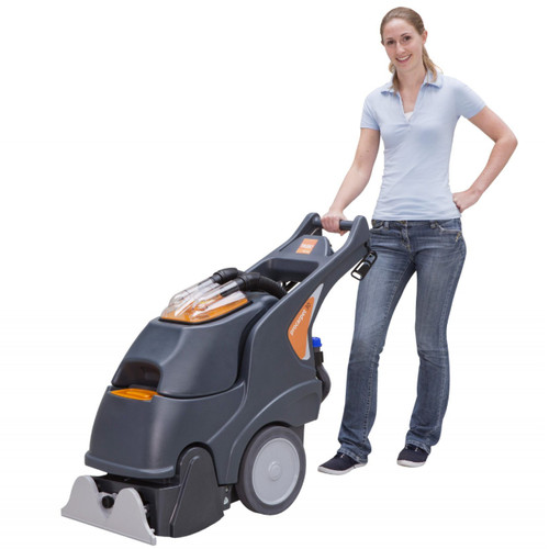 TASKI procarpet 30 commercial carpet extractor in use operator pushing machine in hospitality cleaning environment