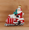 Santa Riding Sparkling Red Train Glass Ornament Wood Background