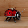 Ladybug Glass Ornament Wood Background Side