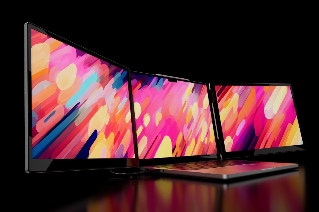 A laptop with two Monduo screens attached, displaying a colorful panoramic wallpaper.