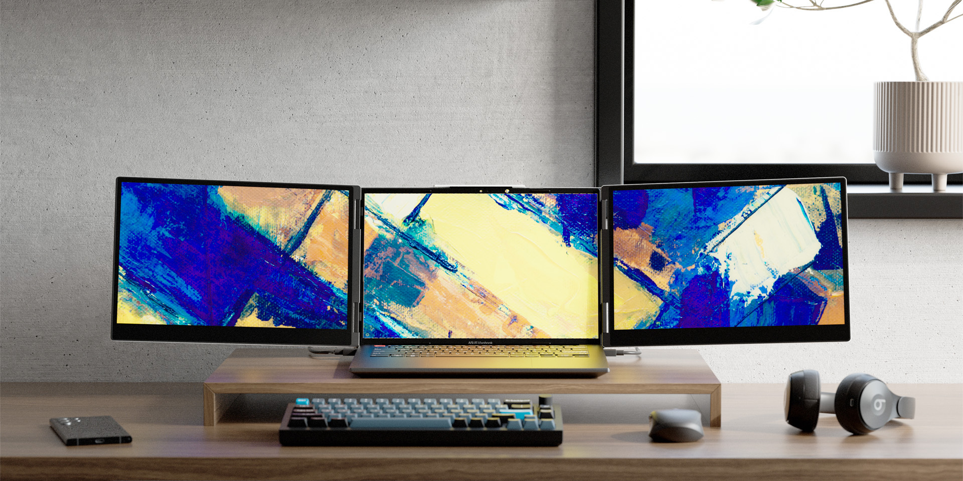 A side-by-side view of two premium desk setups, each showcasing a laptop seamlessly expanded into a tri-screen display with the Monduo portable monitor accessory.