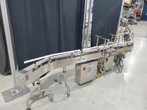 Two Trio-Pac stainless steel raise bed conveyors with side transfer and deviator