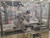 PCM robotic feeder with ABB IRB360 robot, vision system and re-circulating conveyor