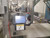 PCM robotic feeder with ABB IRB360 robot, vision system and re-circulating conveyor
