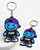 PUKE keyring with blue X-eyes character, purple cap, black PUKE shirt and purple shoes