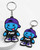 PUKE keyring with blue X-eyes character, purple cap, black PUKE shirt and purple shoes