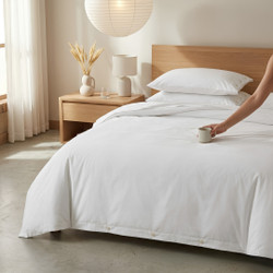 white-200-thread-count-100-percent-cotton-duvet-cover-sets-buttoned-on-bed-hand-demonstrating-quality-bedroom-lifestyle