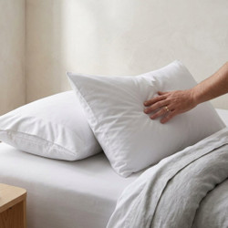 white-144-thread-count-68-pick-polycotton-envelope-style-pillowcases-hand-demonstrating-soft-polycotton-fabric-envelope-closure-design