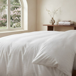 white-200-thread-count-satin-stripe-duvet-cover-on-bed-close-up-showing-stripe-pattern-and-easy-care-finish-bedroom-lifestyle