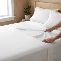 white-200-thread-count-cotton-percale-flat-sheet-on-bed-hands-demonstrating-crisp-cotton-percale-fabric-drape-bedroom-lifestyle