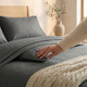 grey-flame-retardant-bedding-on-wooden-bed-duvet-cover-fitted-sheet-pillows-bedroom-lifestyle