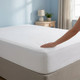 144-thread-count-68-pick-12-inch-deep-fitted-sheet-on-bed-hand-demonstrating-soft-fabric-elasticated-corners-bedroom-lifestyle