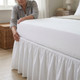 white-180-thread-count-percale-base-valances-lifestyle-woman-fitting-tailored-valance-around-bed-base