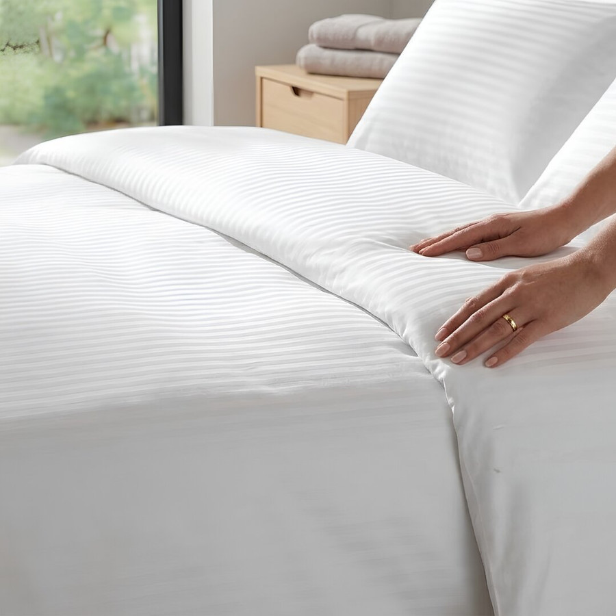 white-200-thread-count-sateen-stripe-microfibre-duvet-cover-close-up-hands-demonstrating-soft-feel-and-stripe-pattern