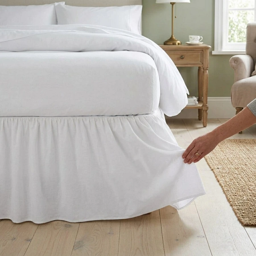 white-68-pick-polycotton-frilled-base-valance-on-bed-hand-demonstrating-frilled-edge-detail-soft-polycotton-fabric-drape-bedroom-lifestyle