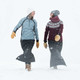 Two women wearing Skhoop Original Insulated Skirts outdoors walking in snow