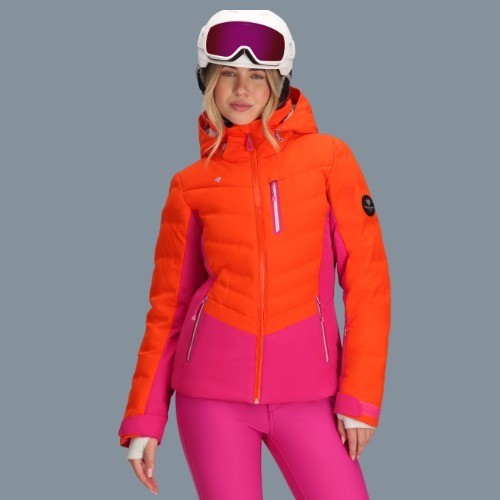 Woman wearing a brign orange and pink Obermeyer ski jacket