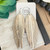 Narrow Platinum/Marble/Cream Fringe Leather Feather Earrings