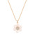 Gold pendant necklace with a daisy design, featuring pink pearl petals and a sparkling crystal-studded center on an adjustable chain.