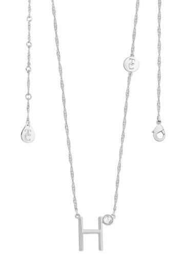 Crafted in sleek polished silver, each unique letter is adorned with a sparkling bezel set clear CZ adding a touch of glamour to these eye-catching pendants. Each letter is positioned at an angle creating a contemporary look. They are suspended from a beautiful shimmering Singapore chain and secure safely with a lobster claw clasp.