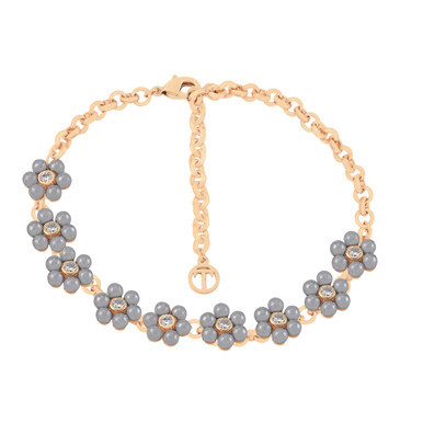 Gold bracelet featuring nine daisy designs with grey pearl petals and crystal centers.