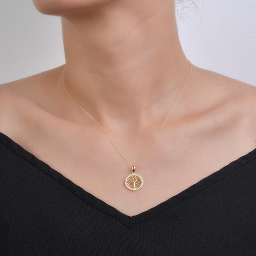 Woman wearing a 925 silver Tree of Life necklace, hypoallergenic jewelry