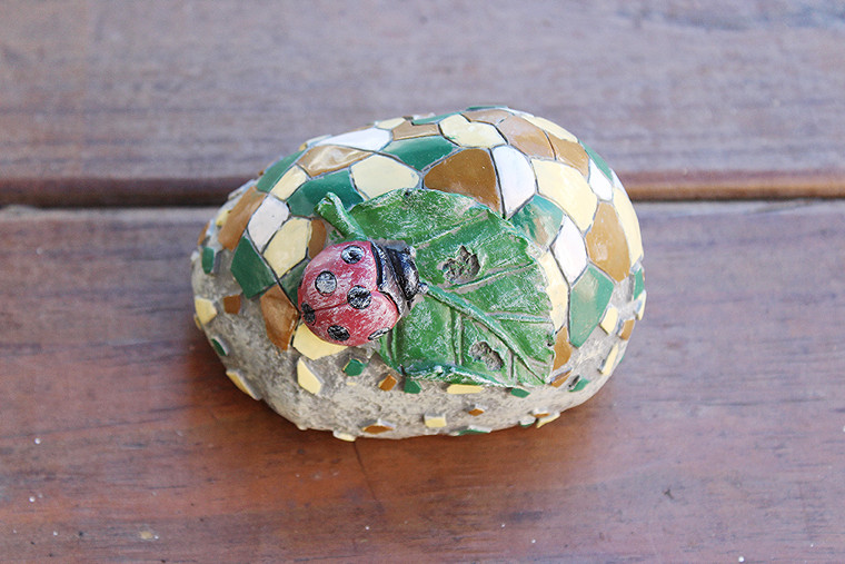 Garden Rock Lady Bug Eating Green Leaf