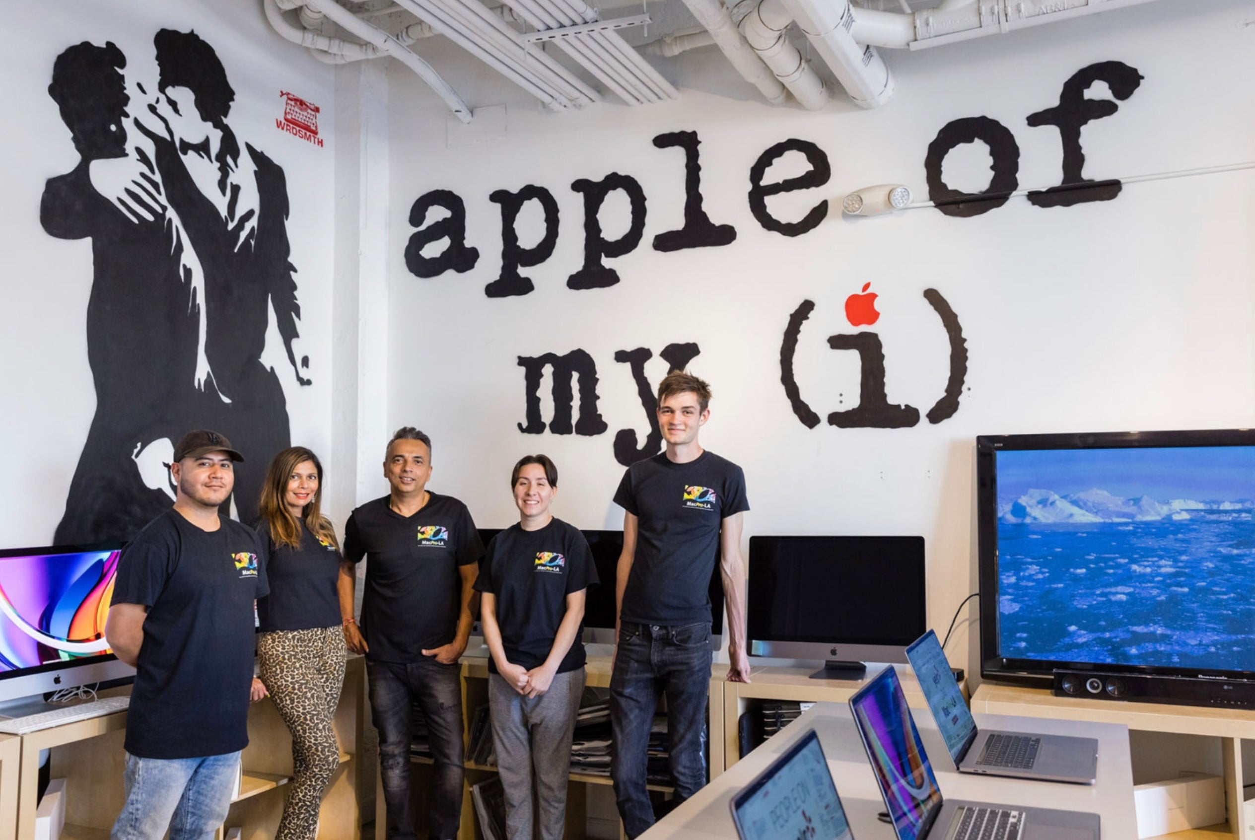 MacPro-LA team inside the Hollywood store with apple of my i mural by WRDSMTH