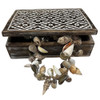 wooden jewelry or trinket box with a carved batik design,
The box features a distressed wood finish and a white top panel with an intricate floral motif. 
It is designed for storing small items like jewelry, trinkets, or other collectibles. 
size 29 x 21 08cm **shell garland not included**