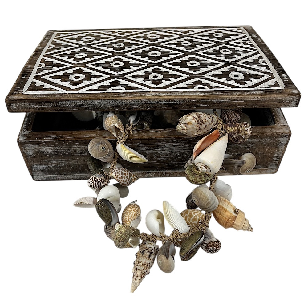 wooden jewelry or trinket box with a carved batik design,
The box features a distressed wood finish and a white top panel with an intricate floral motif. 
It is designed for storing small items like jewelry, trinkets, or other collectibles. 
size 29 x 21 08cm **shell garland not included**