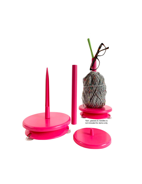 SpinnKnitty Yarn station magenta - New trendy tool for crocheters and knitters. Things you can do with SpinnKnitty yarn station.•	5 pcs: SpinnKnitty base, 1 small & 1 large spin disk, 1 Yarn rod, 1 Hollow rod
•	It turns at your own pace as you crochet or knit
•	Interchageable rod
•	For small, medium and large size, thin to larger fiber yarn
•	Crochet or Knit 1 to 5 feet away from your station or more
•	Portable & durable
•	Made in the USA