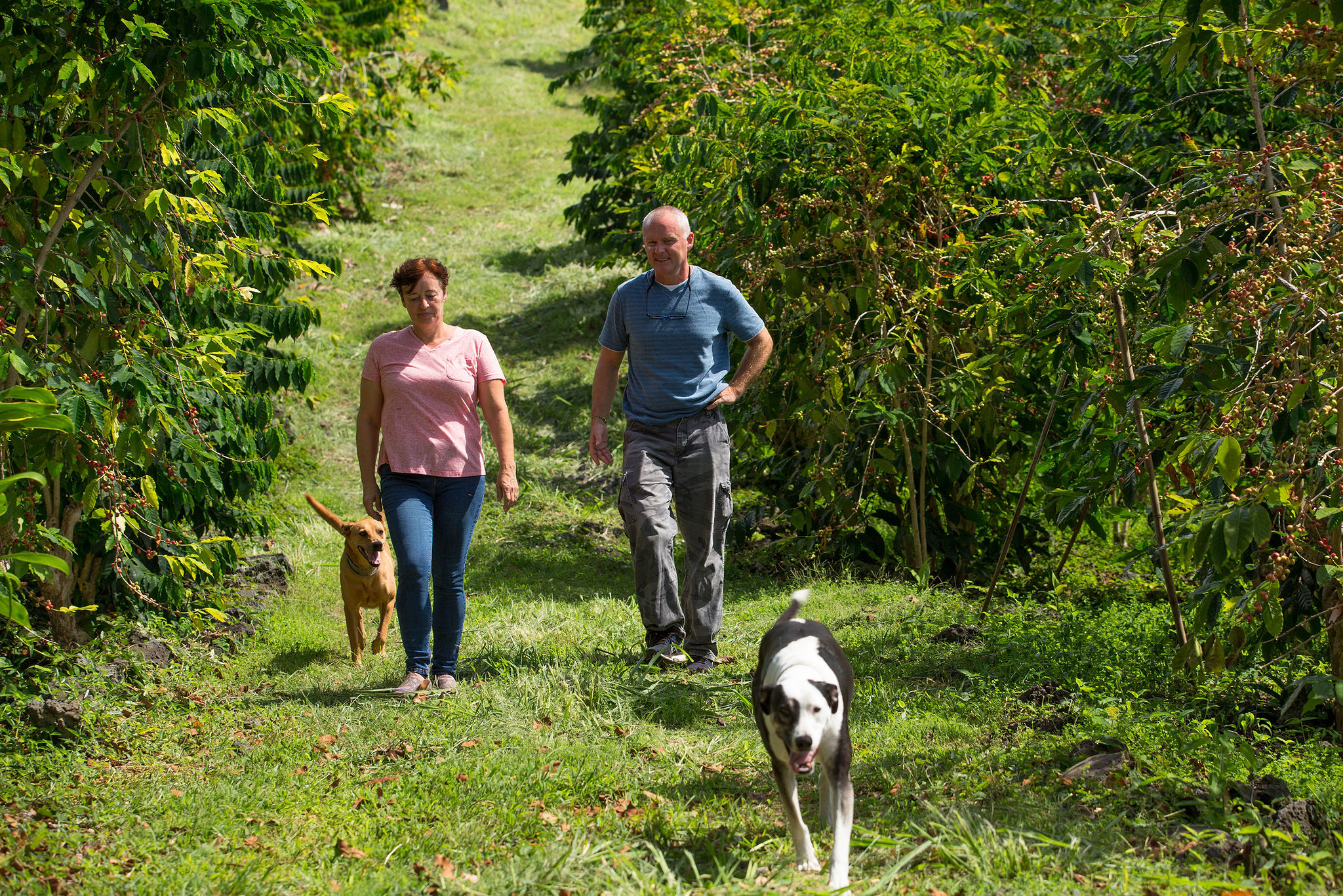 Jean and Danielle walking the orchard
